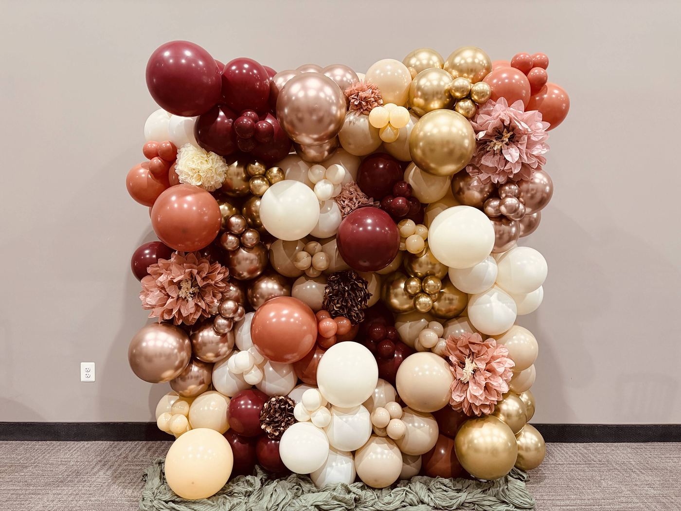 Balloon wall in burgundy, blush, peach and cream